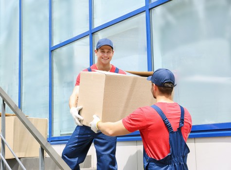 Removal team handling a move in a Canary Wharf apartment block