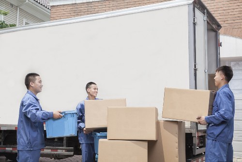 Removal team planning a move in a Canary Wharf apartment building