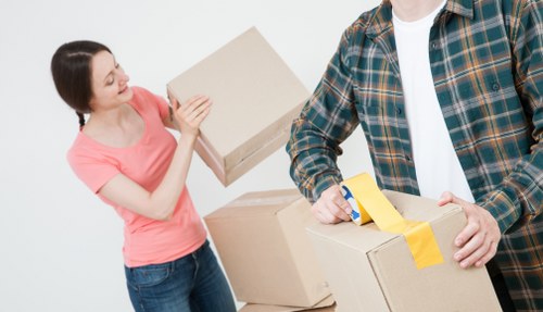 Packed boxes and furniture ready for residential removals in Canary Wharf