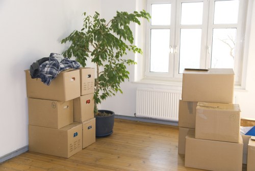 Professional movers placing office furniture during a commercial move